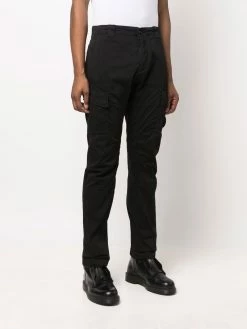 C.P. Company pantalon cargo à détail signature