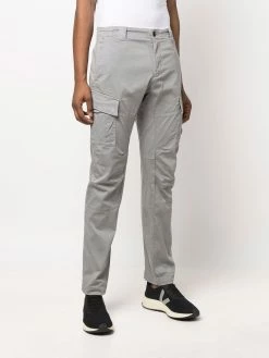 C.P. Company pantalon cargo à détail signature